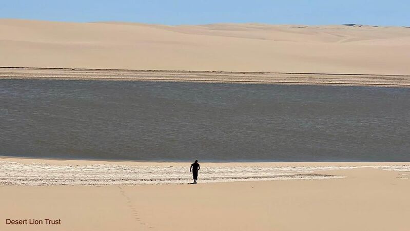 Large pools of rainwater dammed up against the dunes