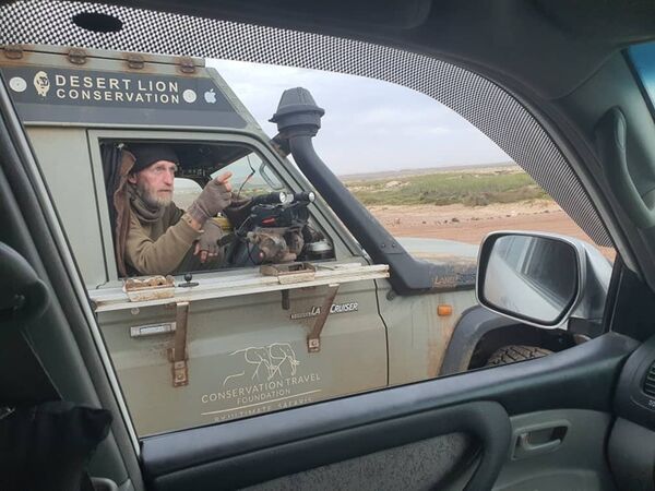 Tourist talking to Lion research vehicle. 