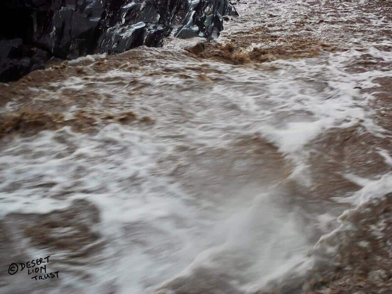 Floodwaters gushing through a narrow gorge at the upper Mudorib spring